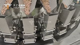 Solution d'emballage d'aliments pour animaux de compagnie | Peseuse associative à 32 têtes + joint de remplissage horizontal